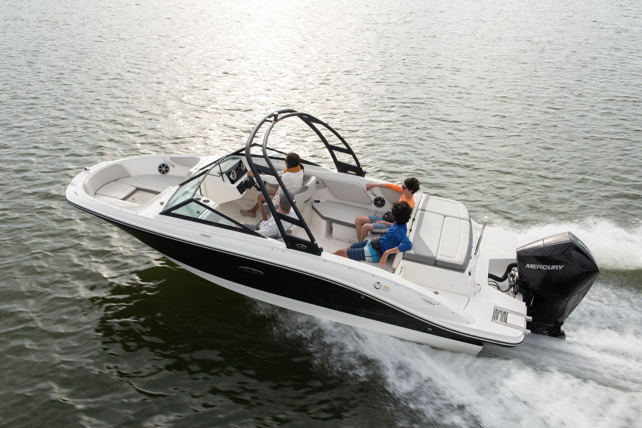 boat on lake with mercury outboard engine