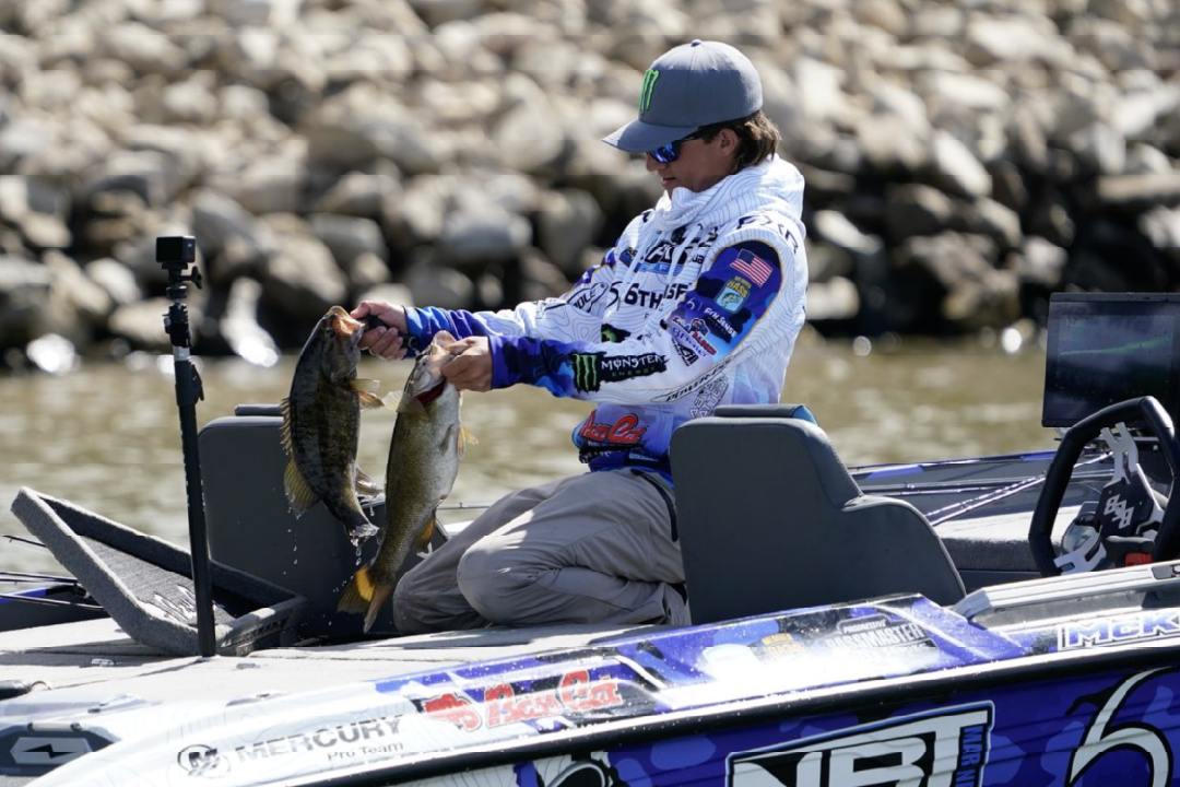professional fishermen checking livewell as bassmaster classic