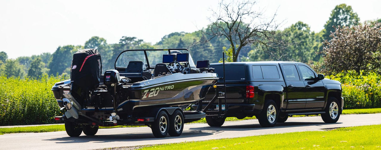 Image of a Boat being towed with a Mercury Marine Cowl Cover on the engine