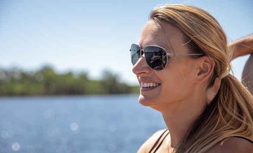 Woman smiling with sunglasses