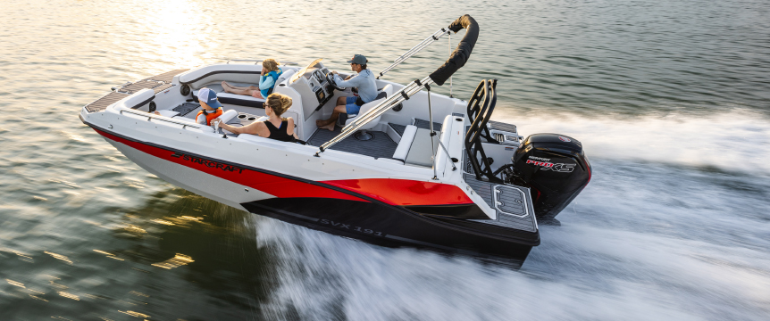 A black and red boat with a Mercury Marine engine