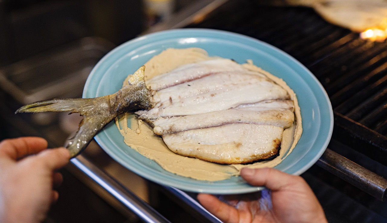 Cook Your Catch: Grilled Pompano with Hummus and Heirloom Tomato and Olive Vinaigrette