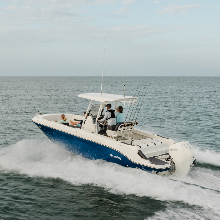 Seafaring fishing boat cruising in the ocean with multiple people with the text Military Repower Rebate