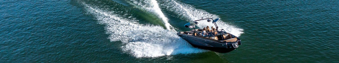 Boat cruising through the water using a Mercury Marine Quicksilver Engine